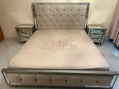 Modern Mirrored Bedroom Set with Tufted Headboard and Matching Nightstands.