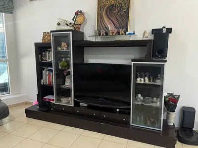 Large dark wood entertainment center with glass cabinets (negotiable)