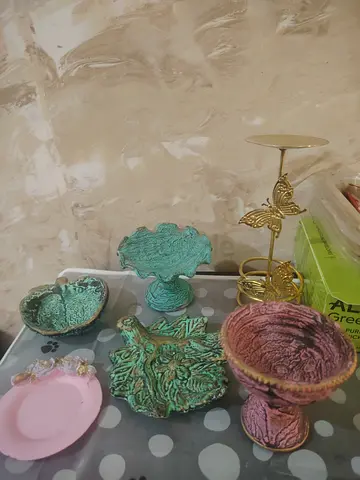 Set of decorative small pedestal bowls and trays - used All decorations +metal candle stand in 15dhs