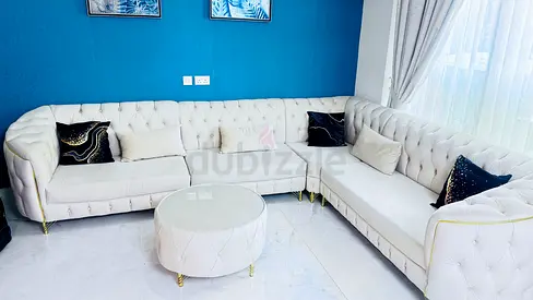 L-shaped 8 seater beige color  sectional sofa with centre - good condition - less than one year used