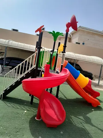 Outdoor childrens playground set with slides and climbing stairs