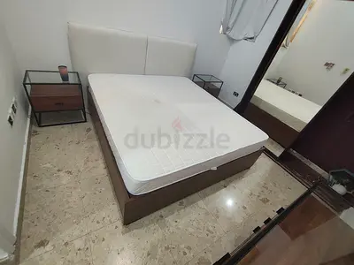 King-size bed frame with two bedside tables and dresser - like new condition