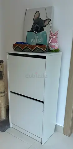White two-drawer shoe cabinet — slim storage unit in good condition