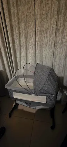 Gray next to me bedside baby bassinet with canopy