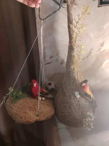 Pair of Hanging Decorative Bird Nests with Artificial Birds. Both are in 25 AED. Very stylish.