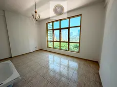 One bedroom and living room for annual rent in Al Majaz 2 Sharjah Free AC Balcony Open view Modern f