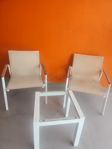 Set of 2 minimalist white metal chairs with small glass-top side table