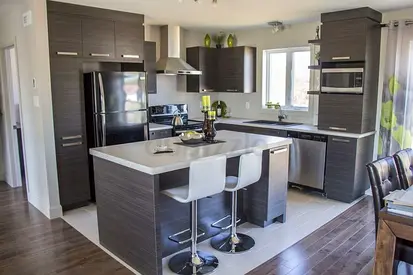 Modern dark wood kitchen with island and bar stools - complete cabinetry set