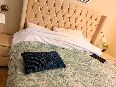 Queen upholstered bed with padded headboard - light beige