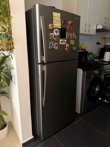 Silver double-door refrigerator, good working condition