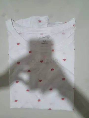 White womens t-shirt with small red heart print, gently used
