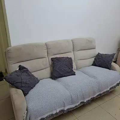 3-seater beige fabric sofa with cushions and throw - good condition
