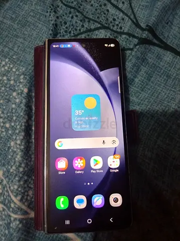 Used Samsung smartphone with cover - good working condition