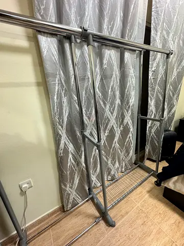 Metal Clothes Rack with Wheels andj Storage Shelf - Good Condition.