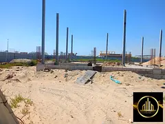 Residential/commercial land for sale, second plot from the main street in Al-Jarf 2