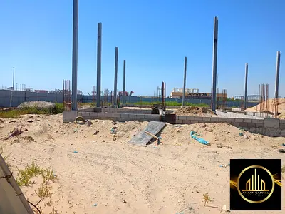 Residential/commercial land for sale, second plot from the main street in Al-Jarf 2