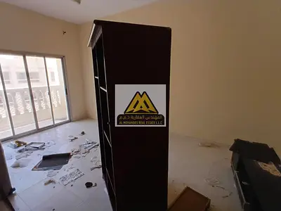 1-bedroom apartment in Al Rashidiya 1 with separate living room, balcony, and central AC. AED 30K y