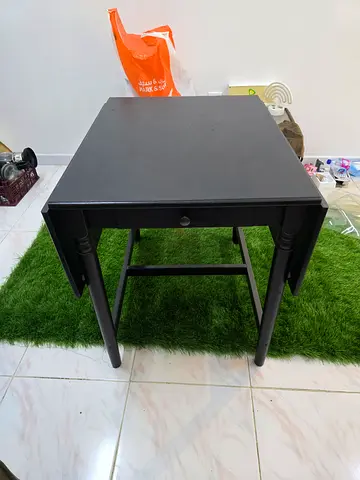 4 seater Small black wooden side table with drawer - reason for sell is shifting house,only table