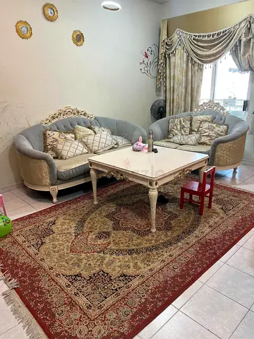 Pair of vintage-style upholstered armchairs with matching side table - cream and grey