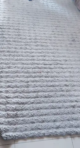 Light beige textured shaggy rug