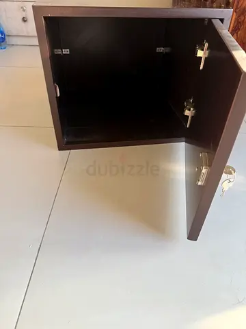 Small dark brown bedside cabinet /loavker with single door and lock