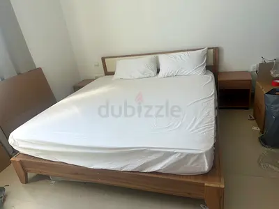 Queen wooden bed frame with two matching nightstands – good condition