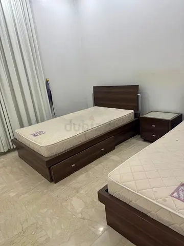 Pair of single wooden beds with storage and mattresses - good condition