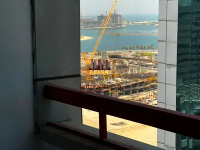 **Two-bedroom apartment with a living room in Al Majaz 2, featuring a balcony, dedicated parking, an open view, two bathrooms, and built-in wardrobes.