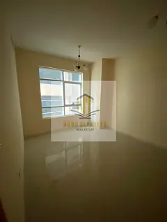 Apartment for annual rent in Al Taawun One bedroom and living room with a balcony offering a side vi
