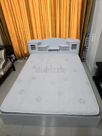 White Bed Frame with Built-in Headboard Storage and Mattress