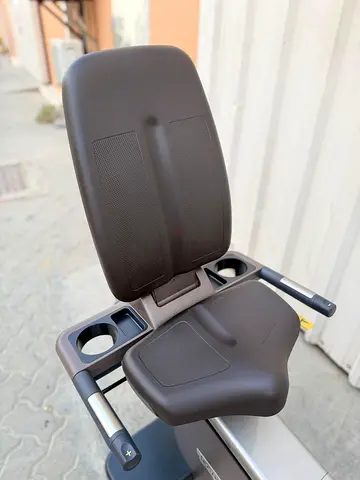 Comfort recumbent exercise bike seat with adjustable armrests and cup holders