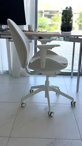White ergonomic office chair with armrests — good condition