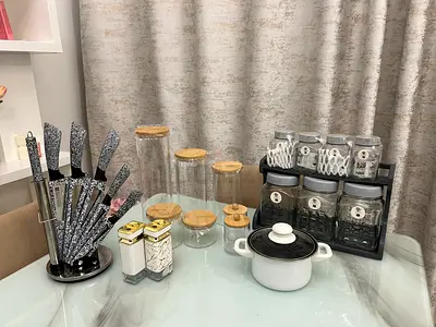 Kitchen countertop set: knife block, spice jars, storage canisters and small pot