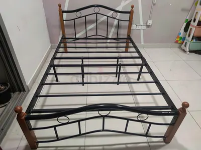 Single metal bed frame with wooden posts - good condition