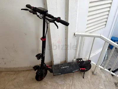 Used Crony Electric Scooter - Dual Suspension, Foldable Deck.warranty available. Brand new
