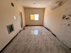 Annual studio with a spacious area, separate kitchen, and split air conditioning, Al Muwaihat 1 area