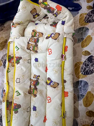 New baby bassinet mattress/liner with teddy print - good condition.