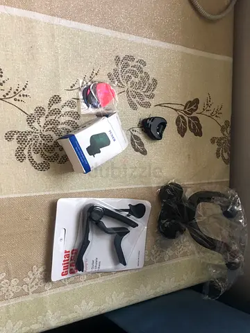 Guitar accessories bundle – capo, picks, wall mounter and tuner