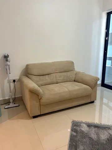 Light beige 2-seater fabric sofa in good condition