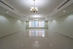 In Al Qasba, a spacious 4-bedroom apartment with a living hall and maid’s room, featuring free air