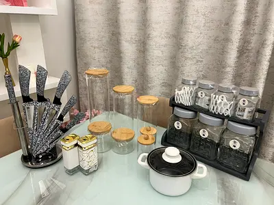 Kitchen countertop set: knife block, spice jars, storage canisters and small pot