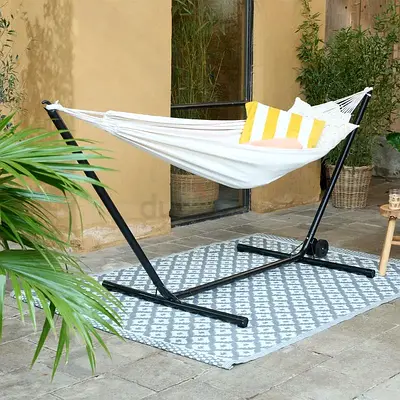 cream-colored hammock with a stand,