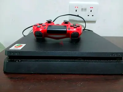 Sony PS4 Slim with Wired DualShock Controller - Good Working Condition. With 3 CDs.