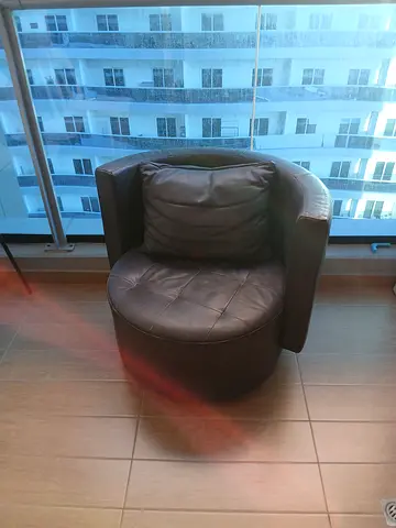 Brown leather swivel lounge chair with ottoman (good condition)