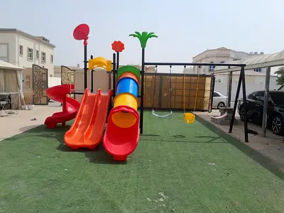 Outdoor childrens playground set with slides and climbing stairs