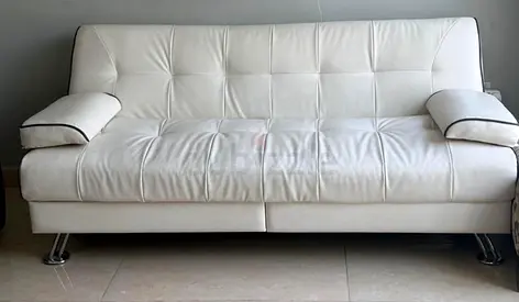White Faux Leather Sofa Bed with Tufted Detail