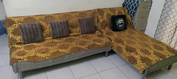 L-shaped sofa-convertible-bed with removable cover