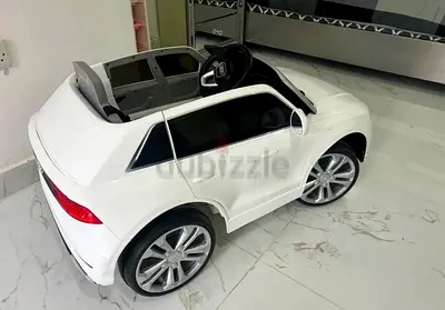 White electric ride-on toy car for kids - good condition
