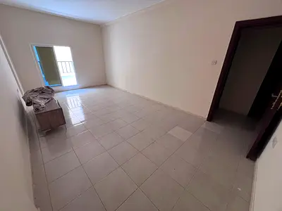 One-bedroom apartment with a separate living room in a prime location near Al Muwaihat roundabout and directly on the exit of Sheikh Mohammed Bin Zaye