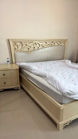 King size bed with mattress and side table